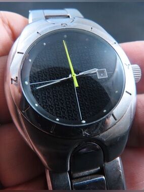 DKNY Silver Stainless Steel Watch with Black Dial and Yellow Second Hand